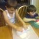 Spread biscuits with rolling pin.