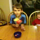 Enjoying their strawberry lemonade slush.