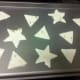 Lay tortilla shapes on baking pan.