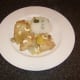 Cashew nuts are sprinkled over the chicken casserole