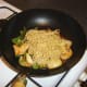 Noodles are added to sweet and sour stir fry and stirred through