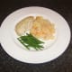 Poached chicken meal is assembled and ready to be garnished