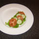 Salad is prepared and plated before omelette is started
