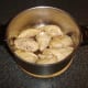 Sealed chicken pieces are added to stew pot