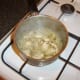 Chicken and mushrooms are brought up to heat in chicken stock