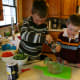 Matthew enjoys grinding pepper into the broth.