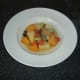 Vegetable casserole is spooned in to serving plates