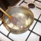 Chopped onion is added to the browning beef