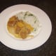 Spicy pork and pineapple casserole is spooned over the rice