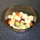 Vegetables and beans are stirred together in casserole