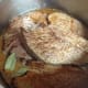 Add the sauce and bay leaves to the pot with the beef