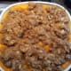 Spoon the topping onto the sweet potato casserole mixture