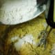 Add the sifted ingredients alternately with the dissolved baking soda into the creamed mixture.