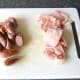 Roughly chop the sausages and bacon
