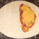 Scatter the cheese on the seasoned beef