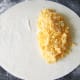 Cheese and onion is laid on pastry