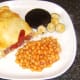 Plating up the big breakfast pasty and accompaniments
