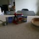 The ingredients for cherry cheesecake: cream cheese, condensed milk, lemon juice, vanilla, and cherry topping.