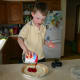 My six-year-old son opened the can of cherry pie filling and spread it on top of the pie!