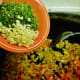 Adding the garlic, parsley, rosemary and sage