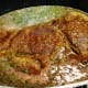 Adding the rest of the wine and roast back into the pan.