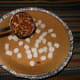 Add 1/4 cup pecan pieces. Add more if desired. Chocolate ice cream pie also tastes great with almonds, peanuts or walnuts.
