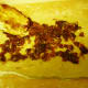 Applying date nut mixture to dough with spatula
