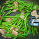 Step 6: Stir and fry the bacon and green beans for a couple of minutes.