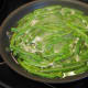 To parboil fresh beans, first cut off the ends of the beans, put them in the pan and cover them with water. Put the heat on and boil for 5 minutes. Get an adult to help you pour off the water. Then put the green beans aside and follow the recipe.