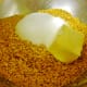 Add the butter and sugar to the cornflakes