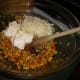 After cooling, add mayonnaise and half of the cheese and cayenne pepper