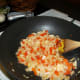 Add yellow onions and red pepper