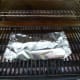 The foil pouch will puff up as the fish cooks.