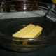 In a large bowl, cream butter.