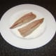 Mackerel fillets are patted in seasoned flour on their skin sides