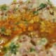 Turmeric and butter added to the momo mixture.