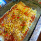 Add a layer of sauce, sprinkle on some veggies and some cheese.