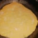 Divide dough onto 10-12 pieces, roll each of them into tortilla and fry each tortilla on a heated pan without butter or oil.