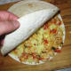 Cover with another tortilla on top and put it into the microwave for 30-50 seconds.