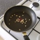 Toasting the pine nuts
