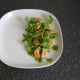 Pine nuts are scattered on salad