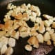 Add the chicken pieces to the same pan and cook until done.