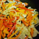 Next add the peppers to the pan.
