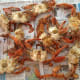 Drain and place crabs on a newspaper-covered table. Time to pick some crabs!