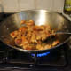 Stir-fry the pork.