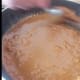 Sugar nearly fully melted - stirring continuously. Don't let it burn!