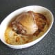 Turkey thigh is removed from the oven and ready to be rested.