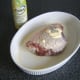 Thigh is rubbed with butter, olive oil or—as in this instance—an alleged heart-healthy substitute for both.