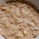Spread with the rest of the cake mixture and then top with flaked almonds
