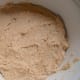 Spread half the mixture in a round 18 cm deep ovenproof dish